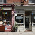 Vintage shop and cafe in Norwich showcasing eclectic storefronts and vibrant signage.