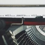 Classic typewriter with text 'rewrite... edit...' on paper.