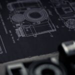 Detailed blueprint of a camera with an official patent from the United States Patent Office.
